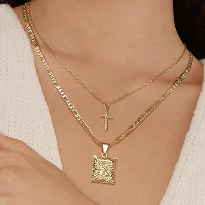 Halsbandsset med kors och initial | Guld