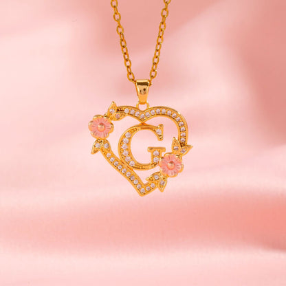 Halsband med blomberlock och initial | Guld
