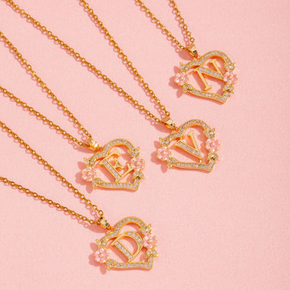 Halsband med blomberlock och initial | Guld