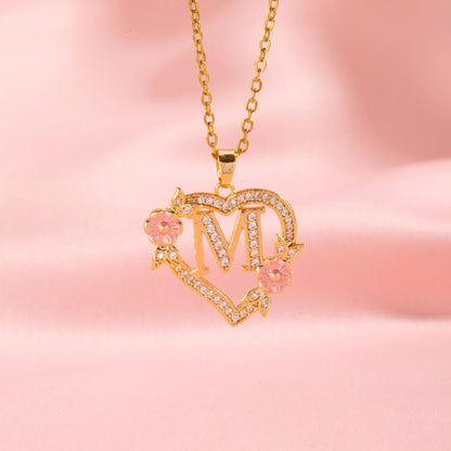 Halsband med blomberlock och initial | Guld