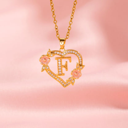 Halsband med blomberlock och initial | Guld